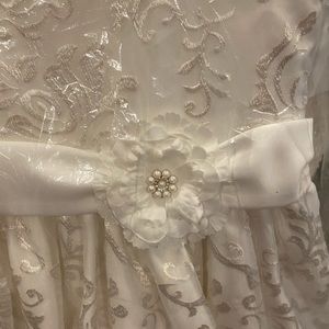 Size 10 ivory flower girl dress with flower on the side